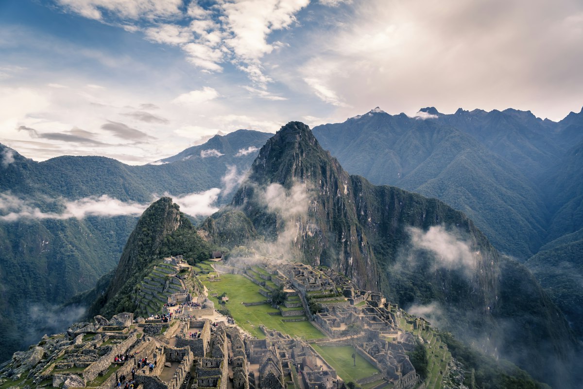 Machu Picchu ancient Inca citadel with terraces and mountain peaks in Peru